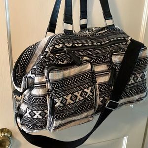 Bohemian travel Bag, fully lined,14”deep w/12x18” base. Black/white woven design